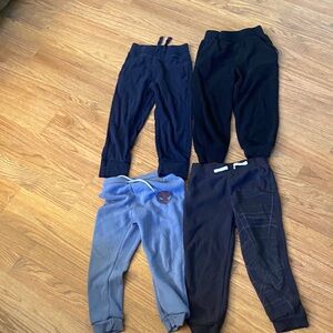 Four pairs of boys size 4T sweatpants. Basic and comfortable